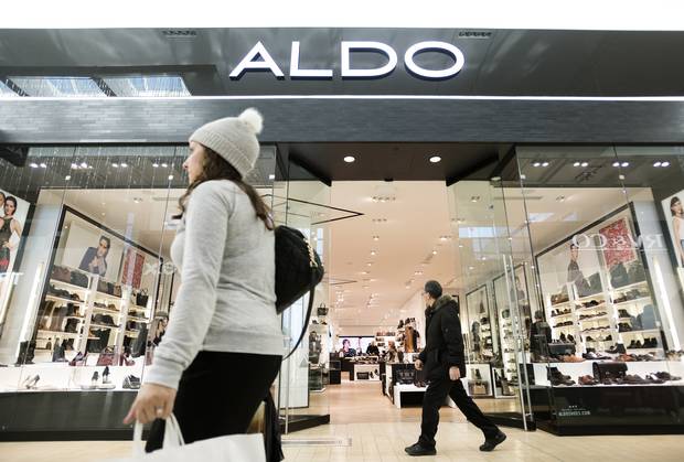 Shoppers walk past the Aldo store in Toronto's Yorkdale Shopping Centre.