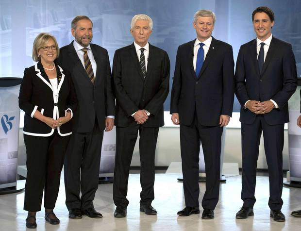 Green party Leader Elizabeth May, NDP Leader Tom Mulcair, Bloc Quebecois Leader Gilles Duceppe, Conservative Leader Stephen Harper, and Liberal Leader Justin Trudeau pose for photos before the French-language leaders' debate in Montreal September 24, 2015.