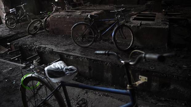 Bicycles used by demolition workers are parked in an abandoned building at the plant.