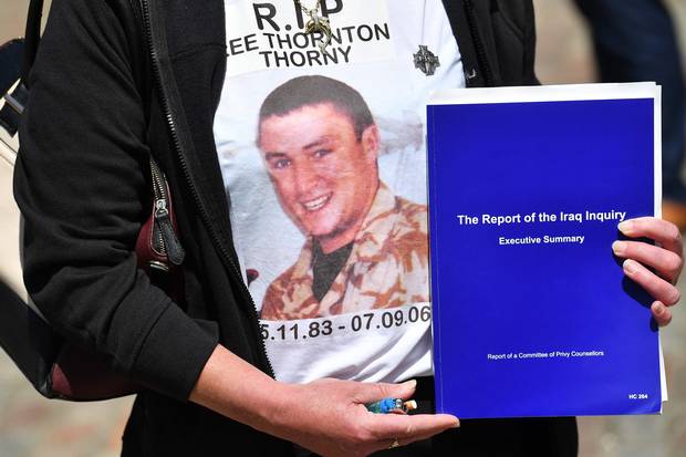 The mother of Gunner Lee Thornton – who died on Sept. 7, 2006, from wounds suffered while fighting in Iraq – holds a summary of the Iraq inquiry report in London on July 6, 2016.