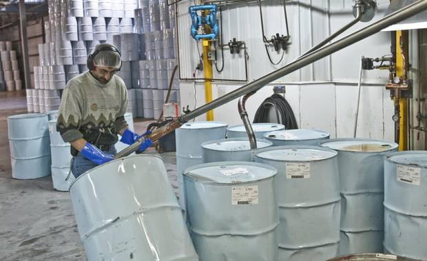 Danny Ayotte fills drums with Maple syrup, prepping it for pasteurization at the International Strategic Reserve in Saint-Antoine-de-Tilly, Que.