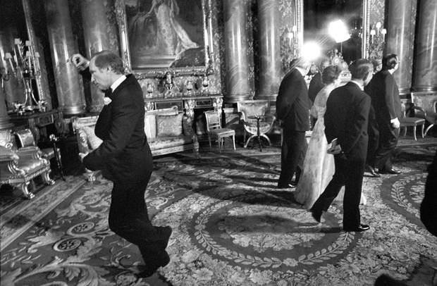 Pierre Trudeau pirouettes behind the Queen during a May 7, 1977, photo session at Buckingham Palace in London.