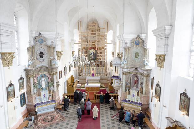 A ceremony in the Roman Catholic Church of the Assumption of Virgin Mary in Piedruja, a town in which some residents wish the country had not joined the European Union or NATO, and had instead remained closer to Russia.