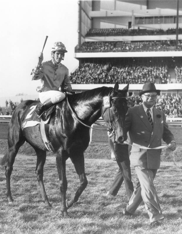 Canebora, led by E.P. Taylor with jockey Manuel Ycaza aboard, following the 1963 Breeders Stakes.