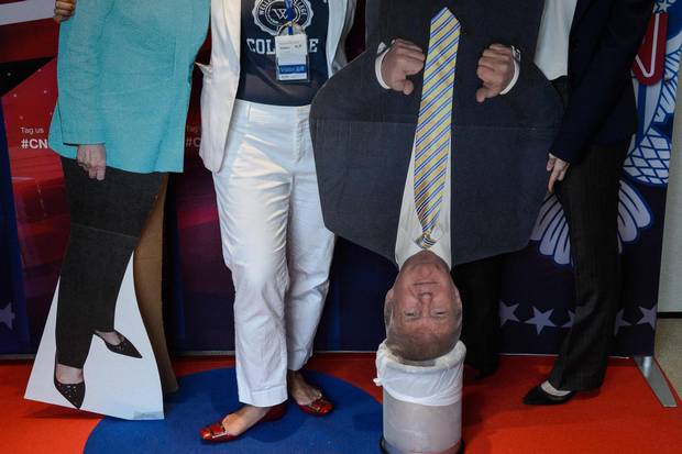 A cardboard cutout of Donald Trump is placed in a bin as people attend a live coverage of the U.S. elections event organised by the American Chamber of Commerce in Hong Kong on Nov. 9, 2016.