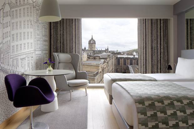 Edinburgh’s city skyline and a line drawing by Jim Hamilton of Graven Images lend character to a Superior Room at the G&V Royal Mile Hotel Edinburgh.