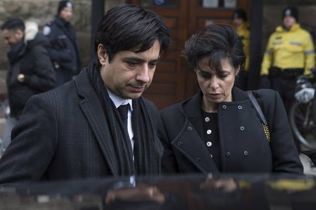 Former CBC radio host Jian Ghomeshi leaves a Toronto courthouse with his lawyer Marie Henein, right, following day six of his trial on Tuesday, Feb. 9, 2016. 