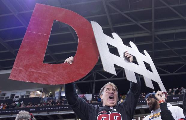 An Ottawa Redblacks fans holds up a 