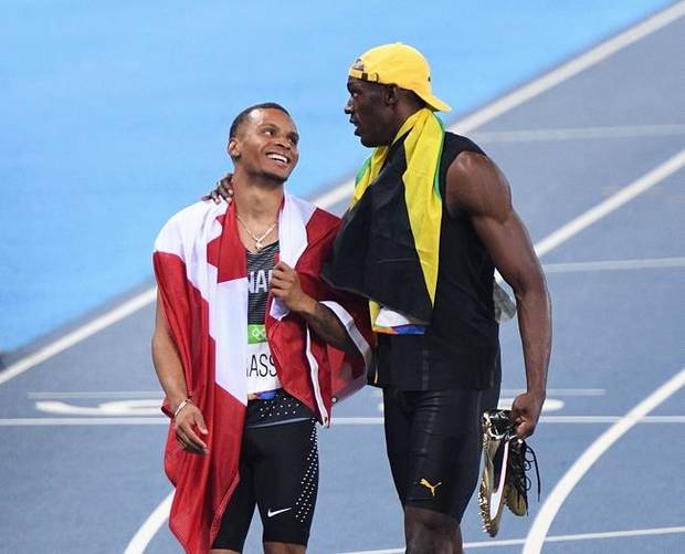 Canada's Andre De Grasse, left, and Jamaica's Usain Bolt share a moment after racing in the men's 100-metre final during the athletics competition at the 2016 Olympic Summer Games in Rio de Janeiro, Brazil on Sunday, August 14, 2016.