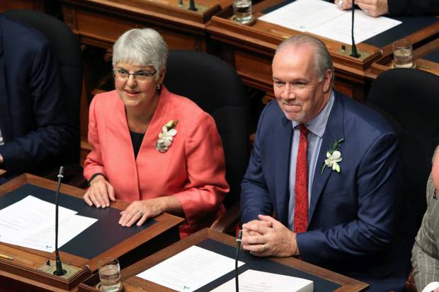 B.C. Finance Minister Carole James, left, and Premier John Horgan in the legislature before the Speech from the Throne on Sept. 8, 2017.
