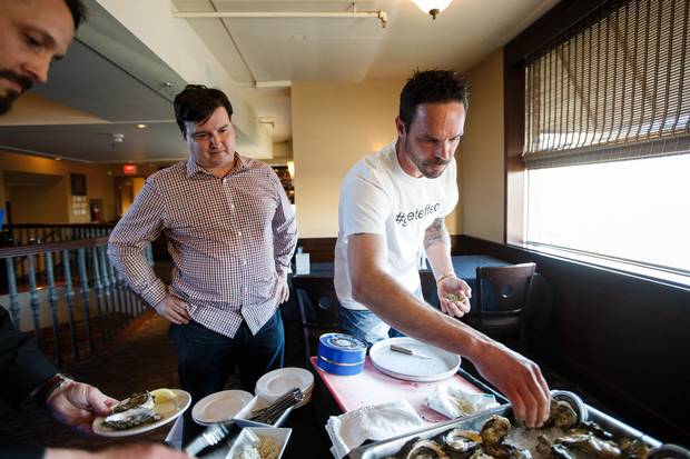 Rob Tryon of Effing Seafoods (right) shucks oysters at Von's Steakhouse in Edmonton, Alta, on Wednesday, April 27, 2016.