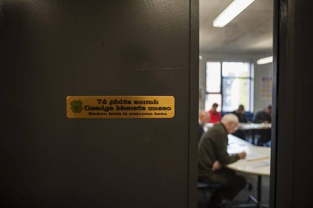 A sign in Irish and English is seen at the door of a Turas classroom at Skainos Square, a conference centre in Newtownards Road, a predominately loyalist neighbourhood in East Belfast. Turas is an Irish-language training program, run by Linda Ervine, that teaches about 200 people, mostly protestant and DUP backers.