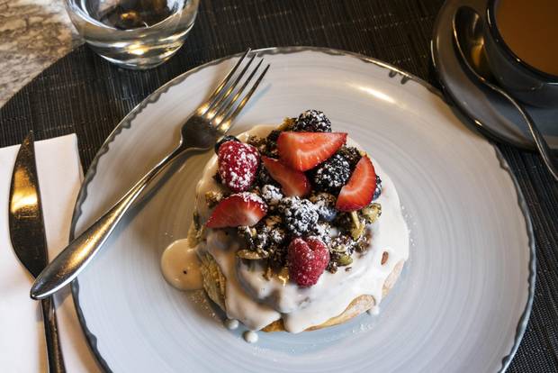 The expensive cinnamon bun at Calgary’s Oxbow is baked fresh each morning and generously covered with strawberry crème fraîche.