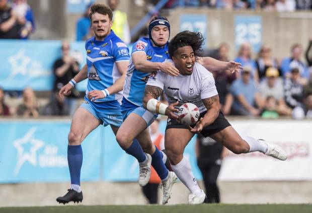 Toronto Wolfpack Fuifui Moimoi is tackled by Barrow Raiders Luke Cresswel during their Kingstone Press League 1 rugby match against at Lamport Stadium in Toronto, Sunday May 21, 2017.