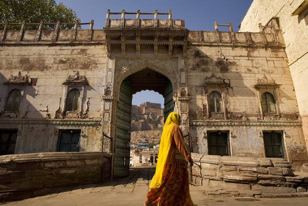 A woman walks near the RAAS hotel in Jodhpur, India, which a thakur (or noble) built in the late 1700s as a home away from his village.