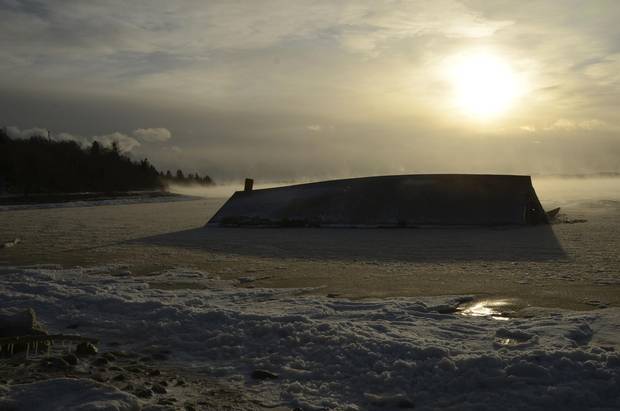 McCurdy's Smokehouse Brining Shed lies broken on the beach at Campobello Island, N.B.