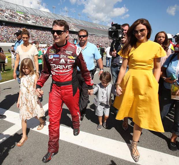 Jeff Gordon walks down pit road with wife Ingrid Vandebosch, daughter Ella and son Leo before the start of the Daytona 500.