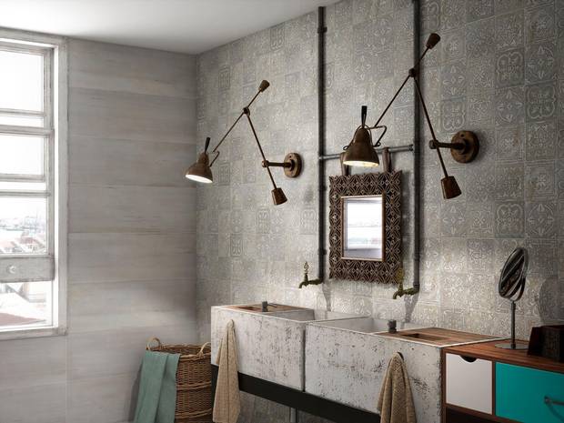 The two walls and sink here, tiled in Kronos by Saloni Ceramica, look like they are made of embossed concrete.