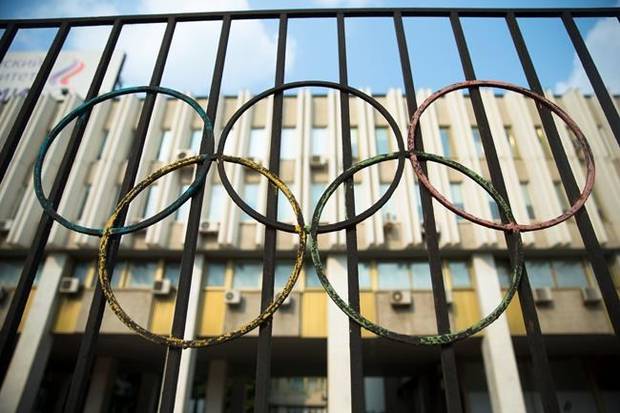 The Olympics rings are seen on a fence in front of the Russian Olympic Committee building in Moscow, Russia, Sunday, July 24, 2016. 