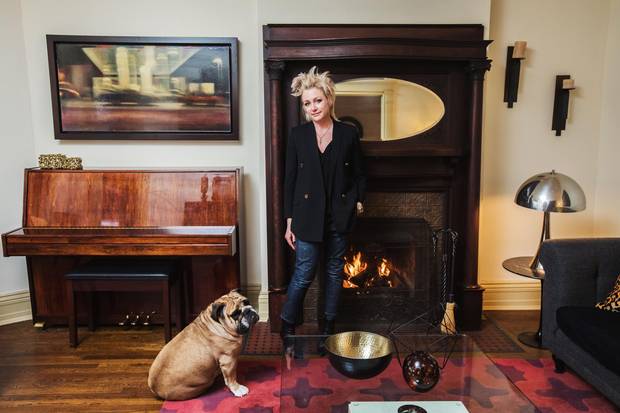 Lawyer Kim Schofield and her dog Spud in the living room of their Parkdale home.