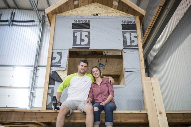 Tyson Leavitt, CEO, craftsman and builder of Charmed Playhouses and his wife Audrey design and build luxury children playhouses in Lethbridge, Alberta. 