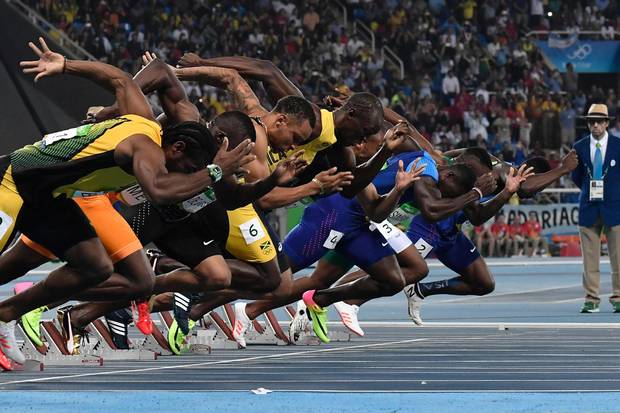 TOPSHOT - (L-R)Jamaica's Yohan Blake, Ivory Coast's Ben Youssef Meite, Canada's Andre De Grasse, Jamaica's Usain Bolt, France's Jimmy Vicaut, USA's Justin Gatlin, South Africa's Akani Simbine and USA's Trayvon Bromell compete in the Men's 100m final during the athletics event at the Rio 2016 Olympic Games at the Olympic Stadium in Rio de Janeiro on August 14, 2016. / AFP PHOTO / Jeff PACHOUDJEFF PACHOUD/AFP/Getty Images