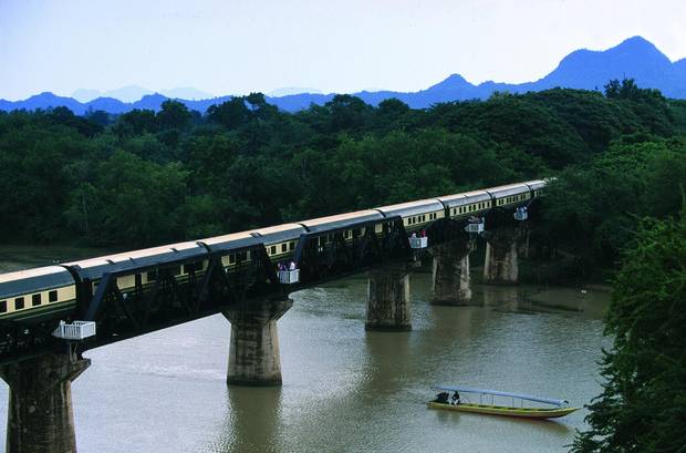 The E&O Express crosses the iron bridge made famous by the 1957 film, The Bridge Over the River Kwai. 