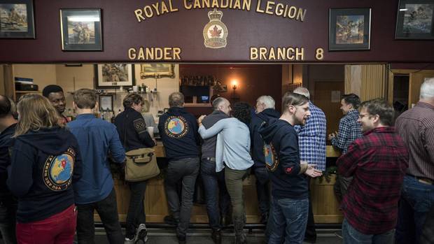 Members of the cast and crew of Come From Away gather with locals at the Legion in Gander, N.L. on Oct. 30.
