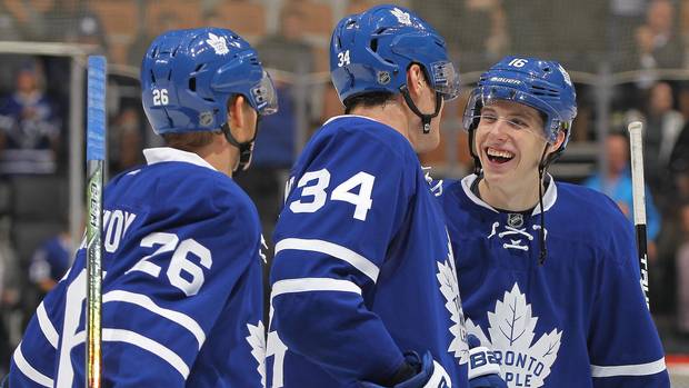 Mitchell Marner (16), Auston Matthews (34), and Nikita Soshnikov (26) of the Toronto Maple Leafs celebrate a victory against the Vancouver Canucks in an NHL game at the Air Canada Centre in Toronto on Nov. 5, 2016.