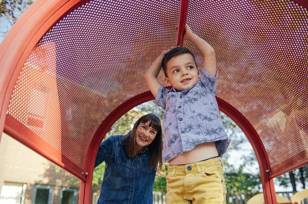 Tonia Krauser and her son Bodhi, 5, spend time in the playground behind Clinton Street Junior Public School on Aug. 26. Krauser is worried about Bodhi’s class size.