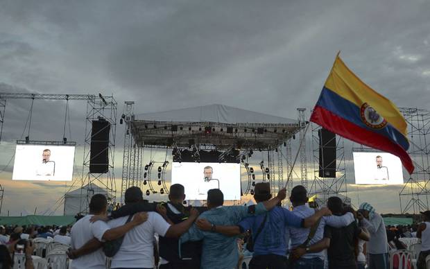 Members of FARC watch the broadcast of the Havana Accord’s signing at El Diamante rebel camp in Caqeta on Sept. 26.