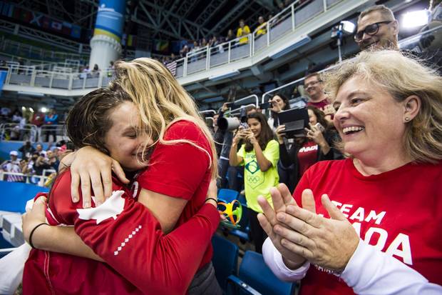 Penny Oleksiak with family members after she won gold in the women's 100-metre freestyle final at the Olympic Aquatics Stadium during the Rio 2016 Olympics on August 11, 2016.