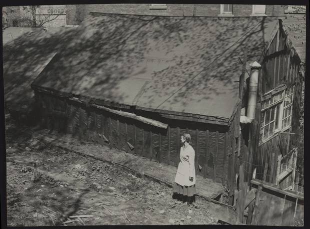 MAY 2, 1957 -- TOM THOMSON'S SHACK -- Sculptor Frances Gage standing outside Tom Thomson's shack in Toronto in May, 1952. Gage had been using it as a studio.
