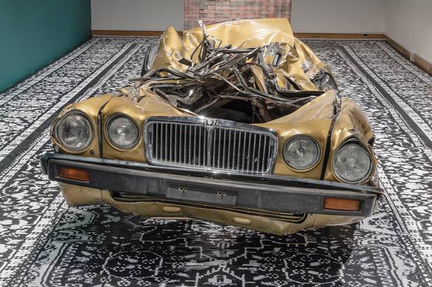 Divya Mehra's gold-painted 1987 Jaguar Vanden Plas represents the damaged American Dream.