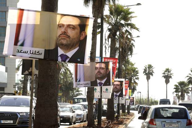 Posters of Lebanese Prime Minister Saad Hariri, who resigned last week in a televised speech airing from the Saudi capital Riyadh, hang on Beirut's seaside corniche on Nov. 10, 2017. The caption in Arabic reads ‘#weareallsaad.’
