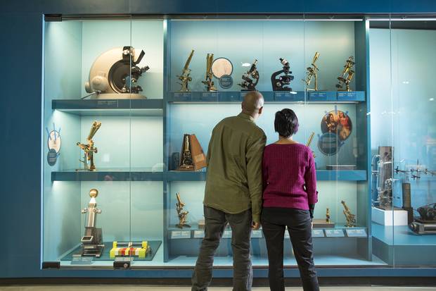 Two museum visitors browse an exhibit in the centre's 'Artifact Alley.'