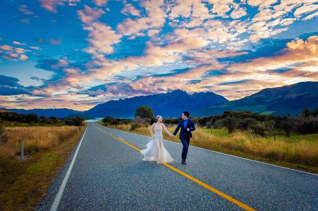 Bride Peng Yuqi and her betrothed Wang Yuchen travelled to New Zealand to take wedding photos in beautiful landscapes they knew from Hollywood. For some Chinese couples, wedding photos are meant to show social prestige as much as their love for each other.