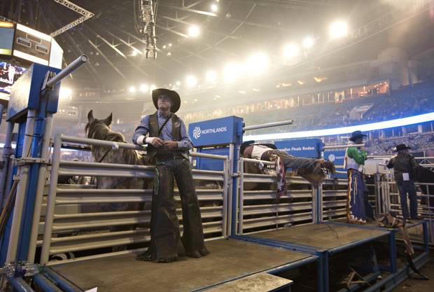 Bareback riding contestant Dantan Bertsch, has a quiet moment near the shoots before the start of the Canadian Finals Rodeo in Edmonton Alberta, November 10, 2016.