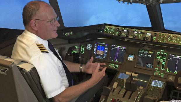 Capt. Rob Johnson sits in the pilot’s seat in a simulator at uFly in Mississauga, Ont.