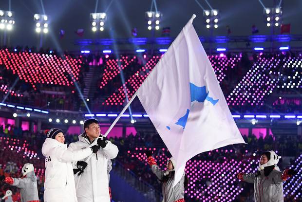 The North Korea and South Korea Olympic teams entered together under the Korean unification flag.