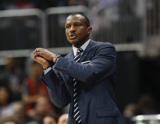 Toronto Raptors head coach Dwane Casey gestures as he talks to an official in the first half of an NBA basketball game against the Atlanta Hawks, Thursday, April 7, 2016, in Atlanta.