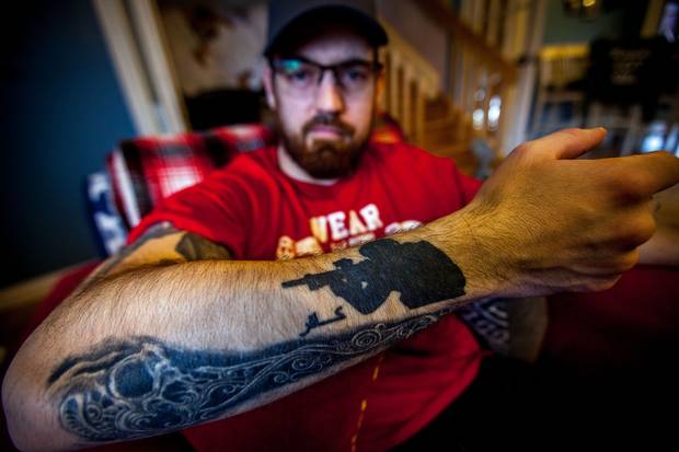 One of Mr. McNeil's tattoos reads ‘infidel’ in Arabic. ‘Kids used to though rocks at us and scream “infidel” so a bunch of us got it tattooed,’ he said.