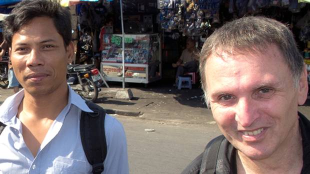 Canadian Dave Walker, right, and Cambodian Sonny Chhoun visiting Phnom Penh, Cambodia, in 2013.