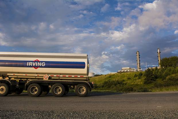 An Irving Oil truck drives past the company's refinery in Saint John in 2014.