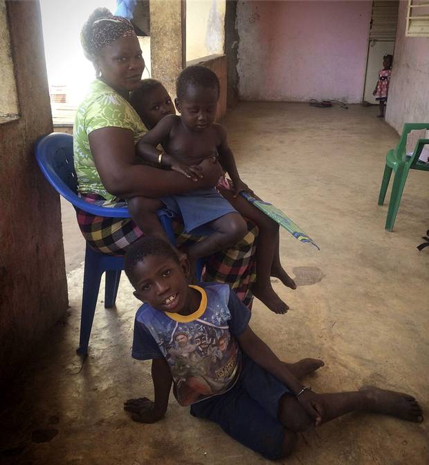 Yessa Camara, 30, shown with her nephews and nieces, has a husband in Spain who sends money back to Senegal to support her and the family’s children.