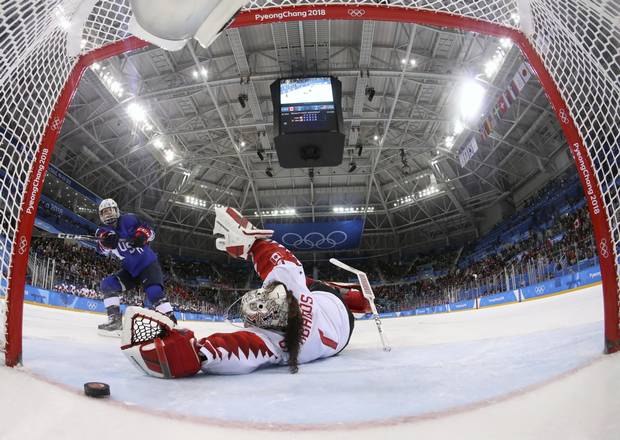 Jocelyne Lamoureux-Davidson of the United States scores in a shootout vs. Canada goaltender Shannon Szabados to win the gold medal for the U.S. on Feb. 22, 2018 in Pyeongchang.