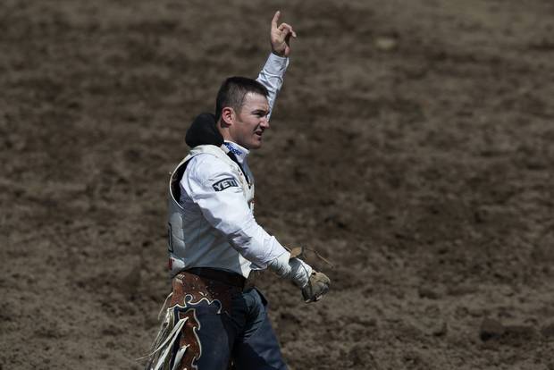 Peebles reacts to his score at the Calgary Stampede rodeo.