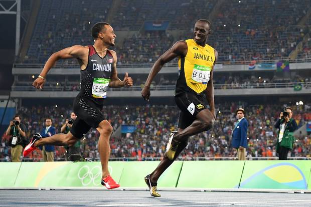 Canada's Andre De Grasse and Jamaica's Usain Bolt compete in the men's 200m semifinal at the Rio 2016 Olympic Games in Rio de Janeiro on August 17, 2016.