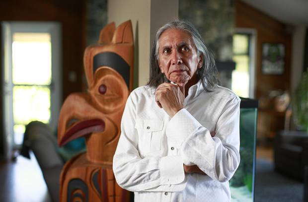 Leonard George, former chief of the Tsleil-Waututh Nation, stands inside his home in North Vancouver in July, 2012.