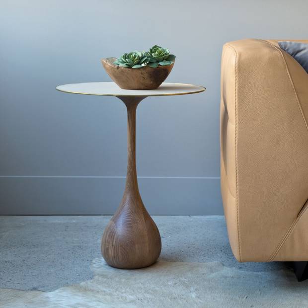 A mezzo side table. Sholto Scruton works with a variety of building materials on both indoor and outdoor furniture, collaborating with designers on custom one-of-a-kind pieces.